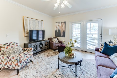 a living room with a couch and a tv