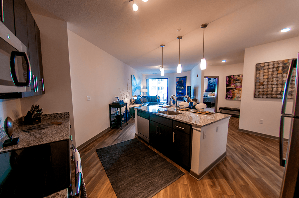 a kitchen and living room with an open floor plan