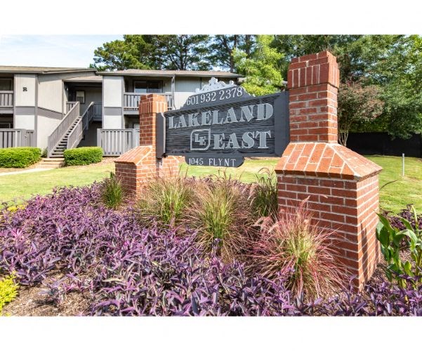 a sign for the larkland clash apartments is shown in front of a building