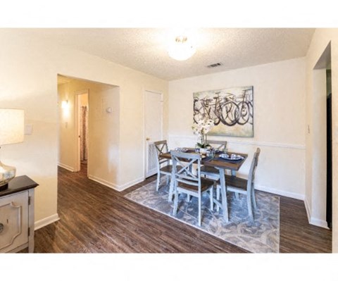 a dining room with a table and chairs