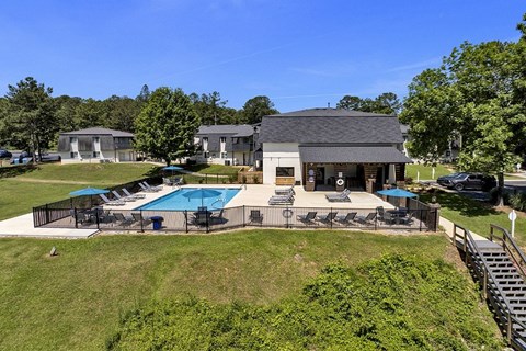 A house with a pool and a deck.