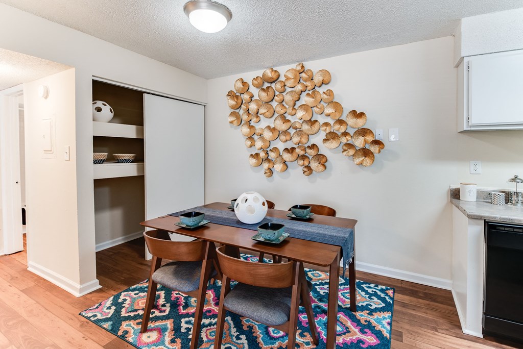 a dining room with a table and chairs