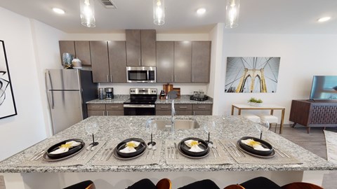 A modern kitchen with a dining table set for four.