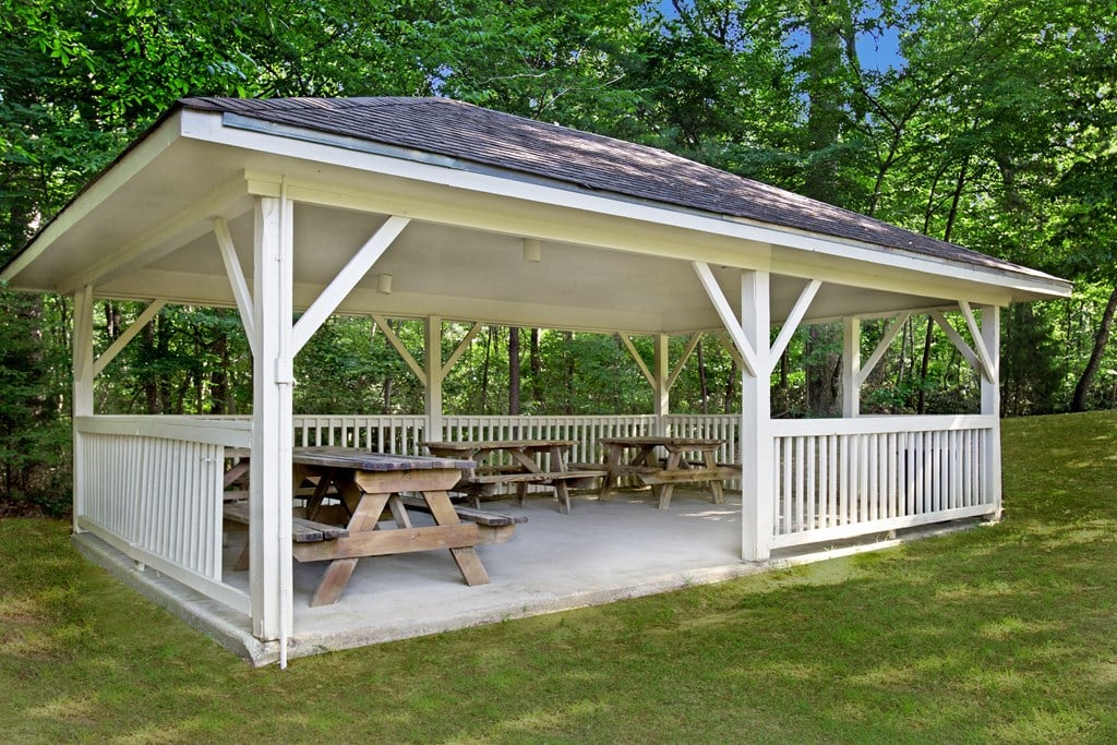 a gazebo with a picnic table on it