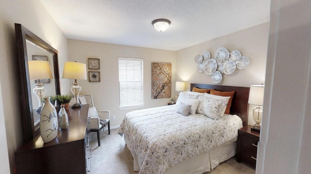 a bedroom with a bed and a dresser