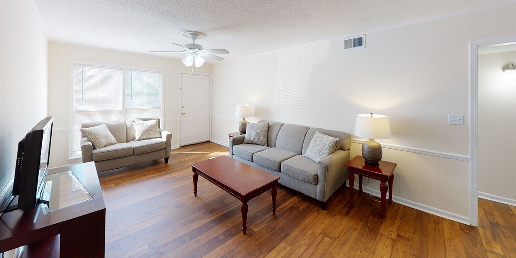 a living room with couches and a coffee table
