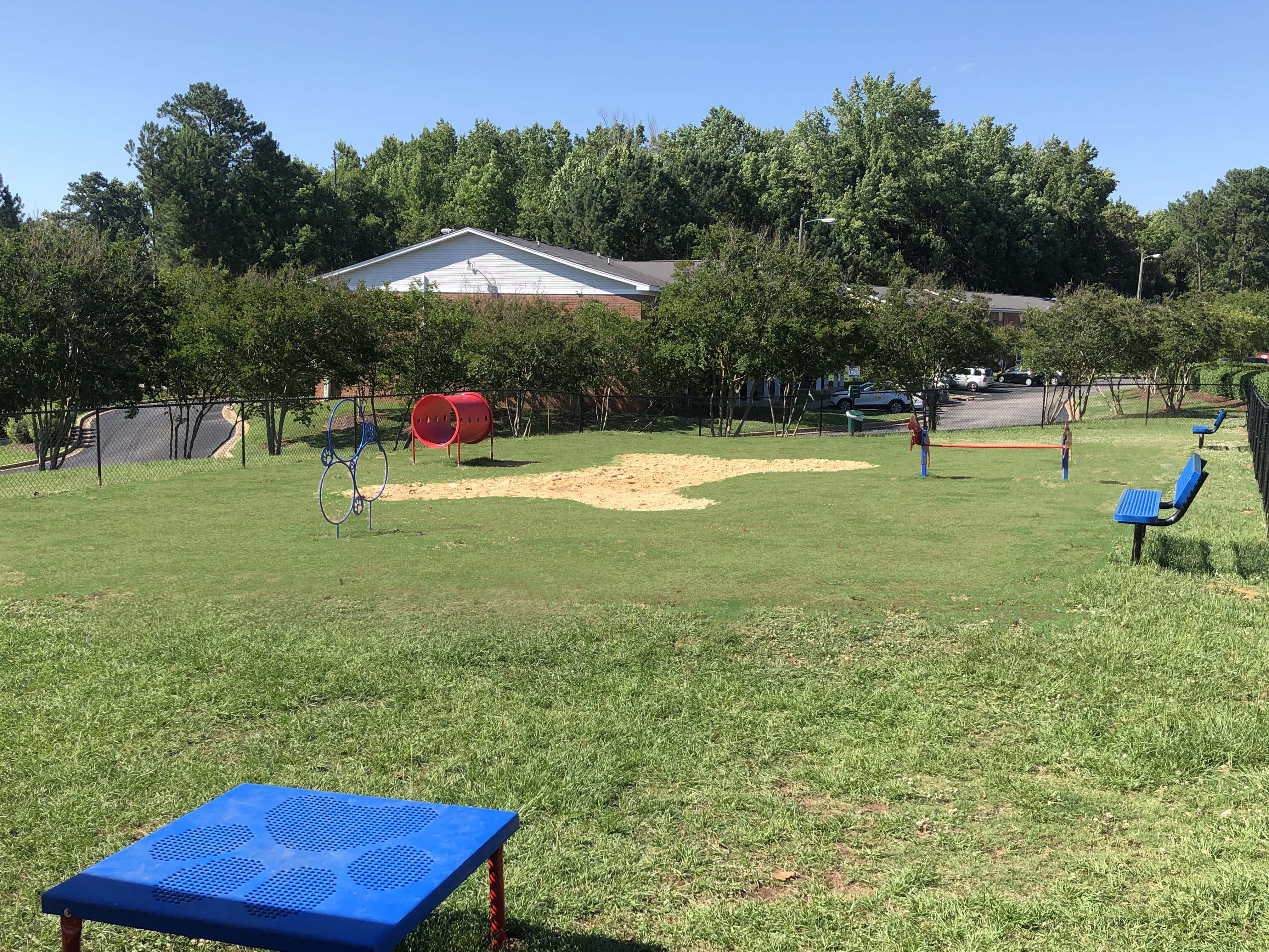 a park with a playground and a picnic table