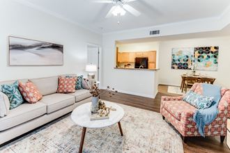 a living room with two couches and two chairs