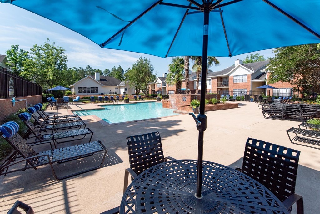 our apartments offer a swimming pool with chairs and umbrellas