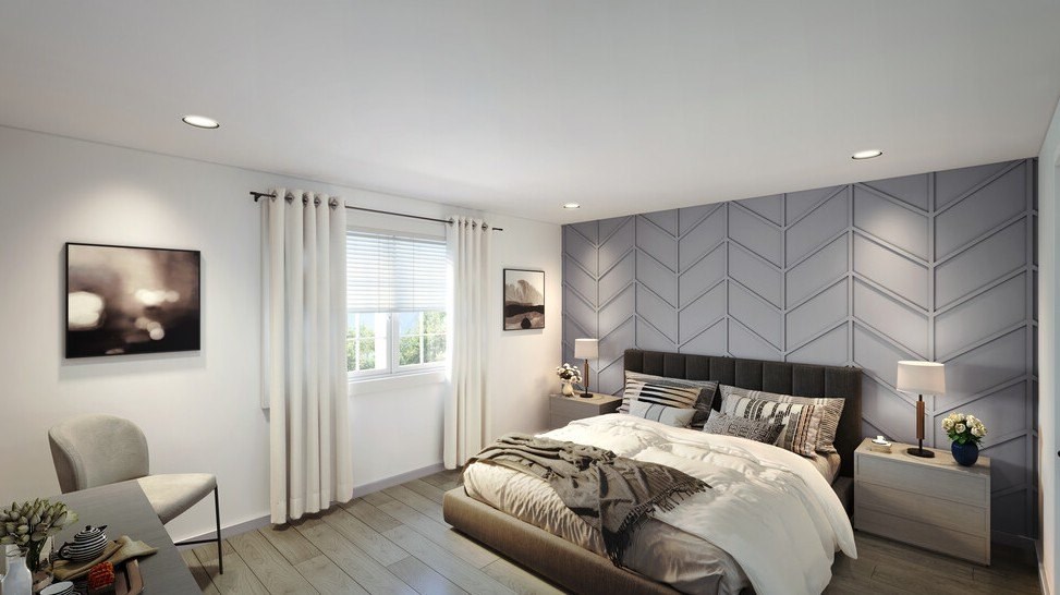 A modern bedroom with a large bed and a grey patterned wallpaper.