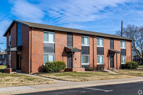 A red brick apartment building with a black roof. at Blacklark Apartments, Kansas City, 66101