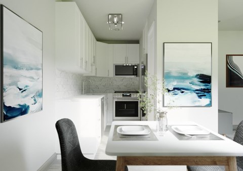 A modern kitchen with a dining table and chairs.