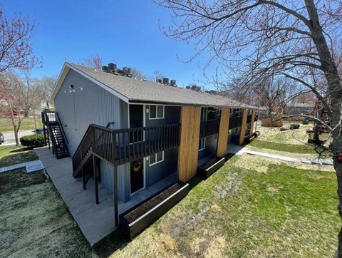 building view with a deck and staircase