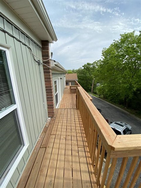 a long wooden staircase outside the building