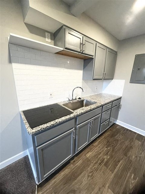 a kitchen with a sink and a counter top