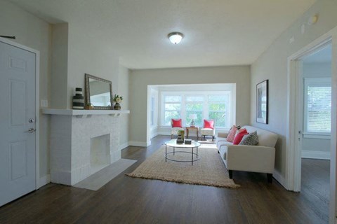 a living room with a couch and a fireplace