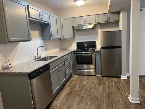 a kitchen with stainless steel appliances and a counter top