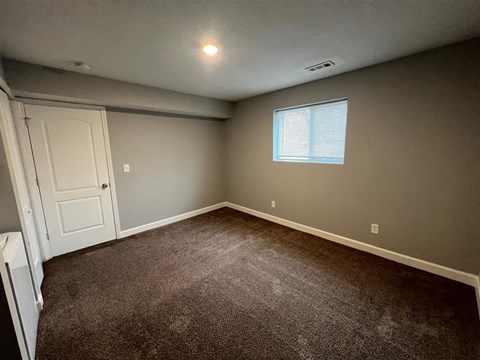 a bedroom and a window