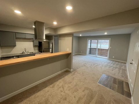 a empty room with a kitchen and a sink