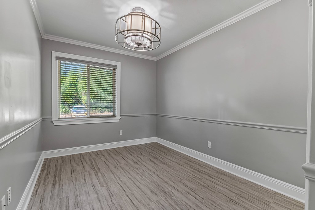 A room with a window and a light fixture.