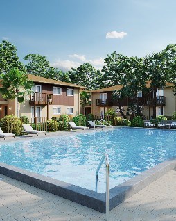 A swimming pool in front of apartment buildings.