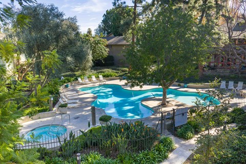 A pool surrounded by trees and plants at The Aspens Riverside, Riverside, 92504