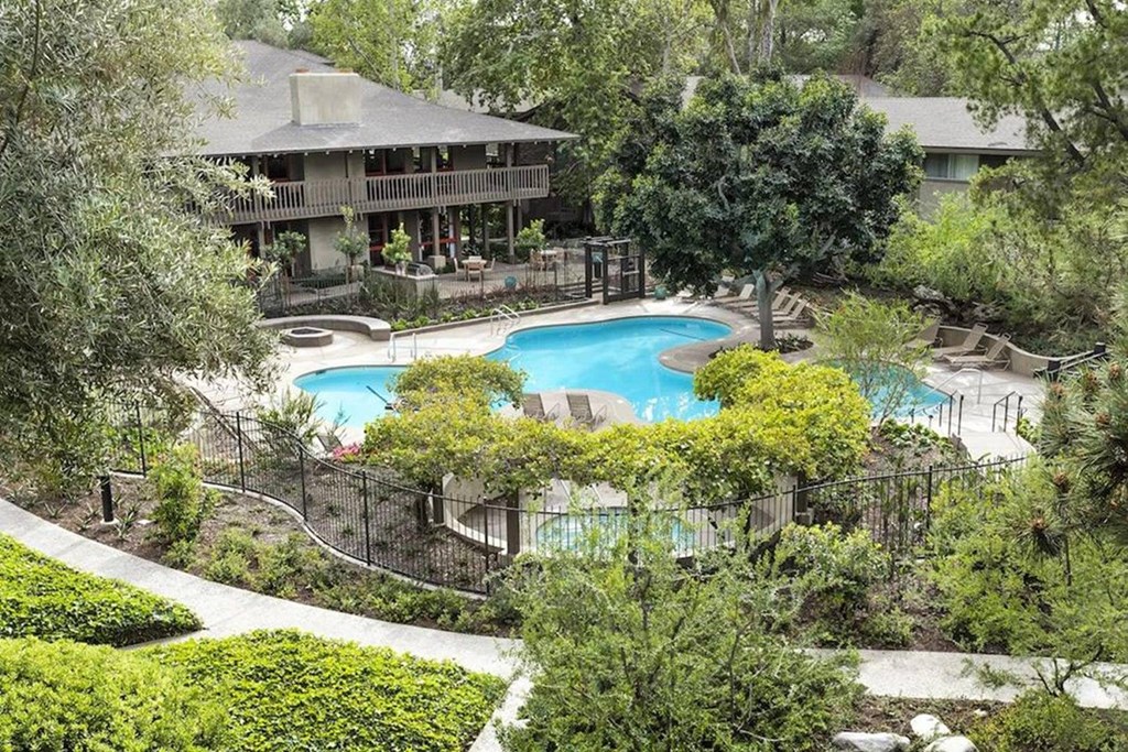 an aerial view of the backyard of a house with a swimming pool at The Aspens Fairhaven, Santa Ana, CA