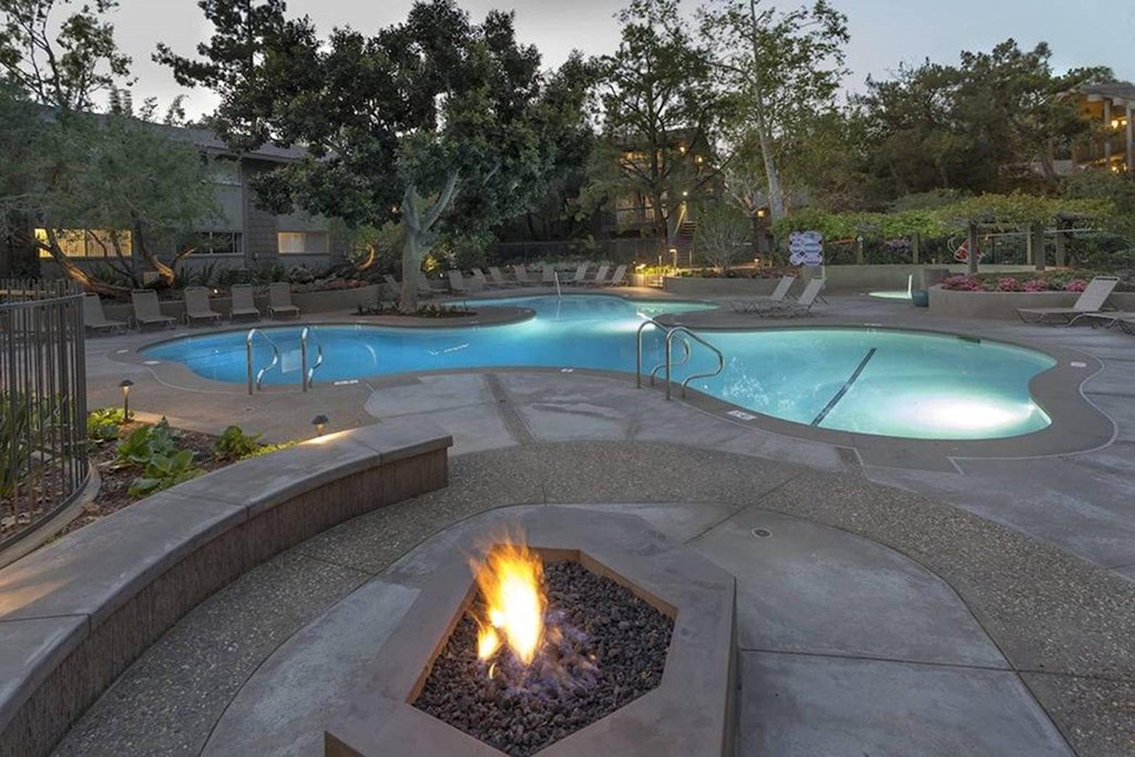 a swimming pool with a fire pit at The Aspens Fairhaven, Santa Ana California