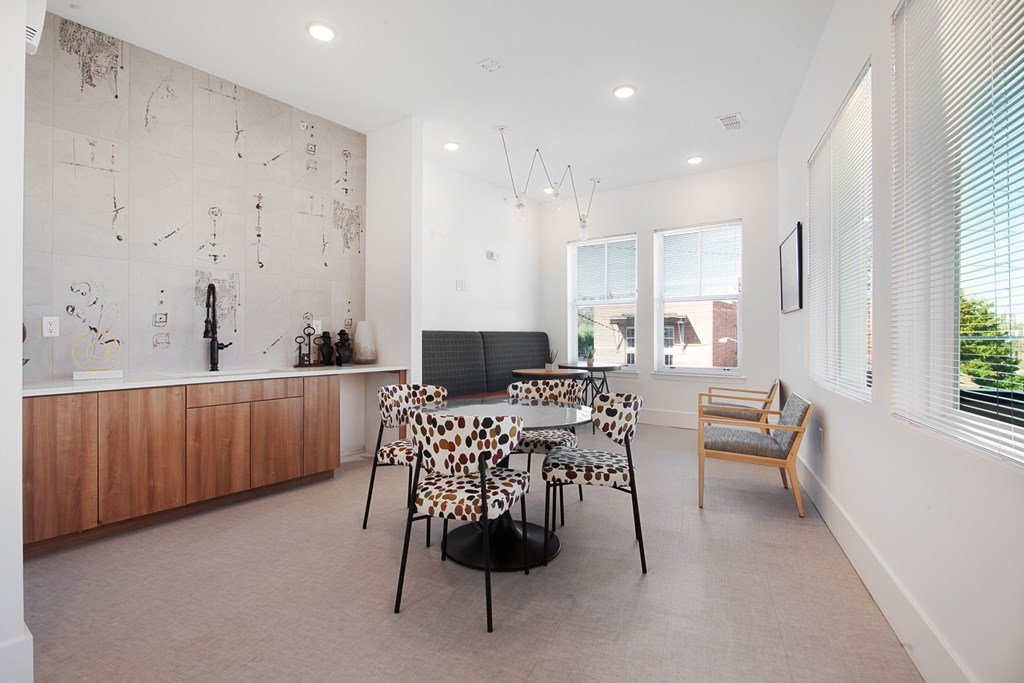 A living room with a leopard print chair and a wooden cabinet.
