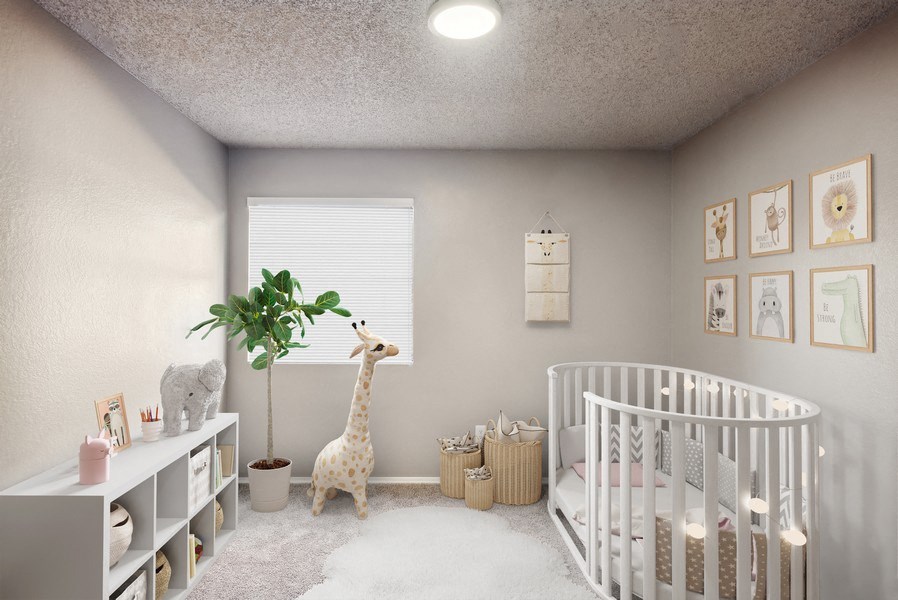 a nursery with a crib and a giraffe in it