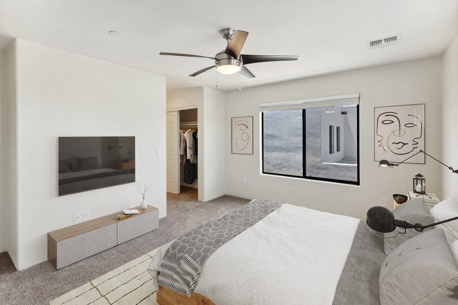 a bedroom with a bed and a ceiling fan at Galeria Del Rio, Tucson, Arizona