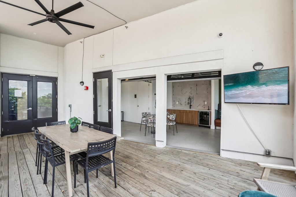 A dining room with a wooden table and chairs.