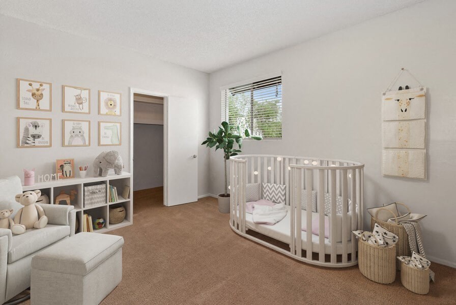 a nursery with a crib and a living room with a couch