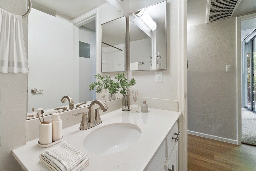 a bathroom with a sink and a mirror