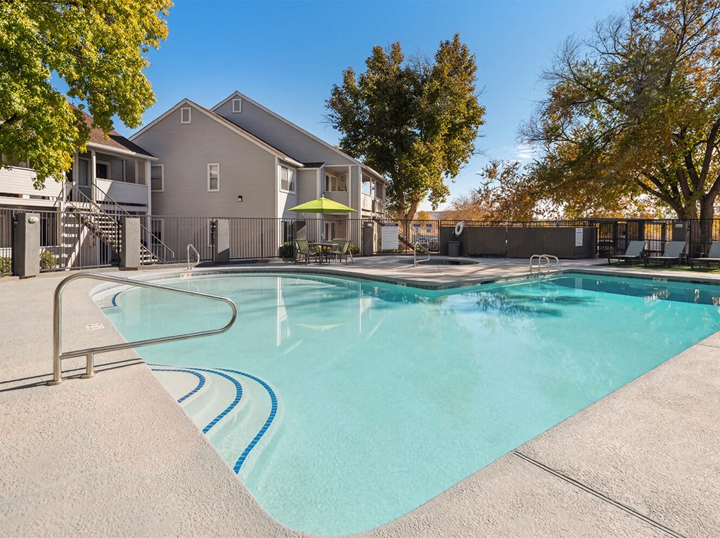our apartments have a resort style pool with trees