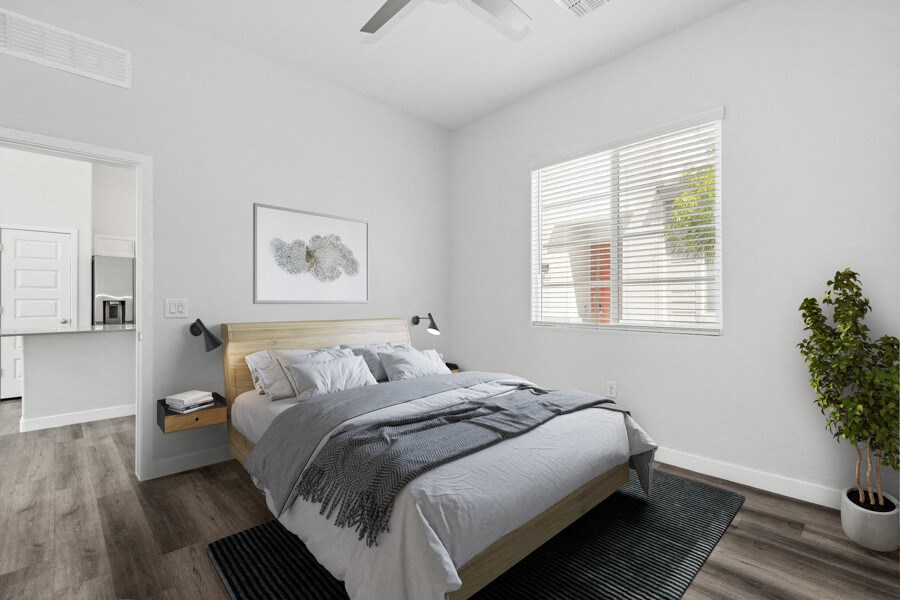 a bedroom with a bed and a window