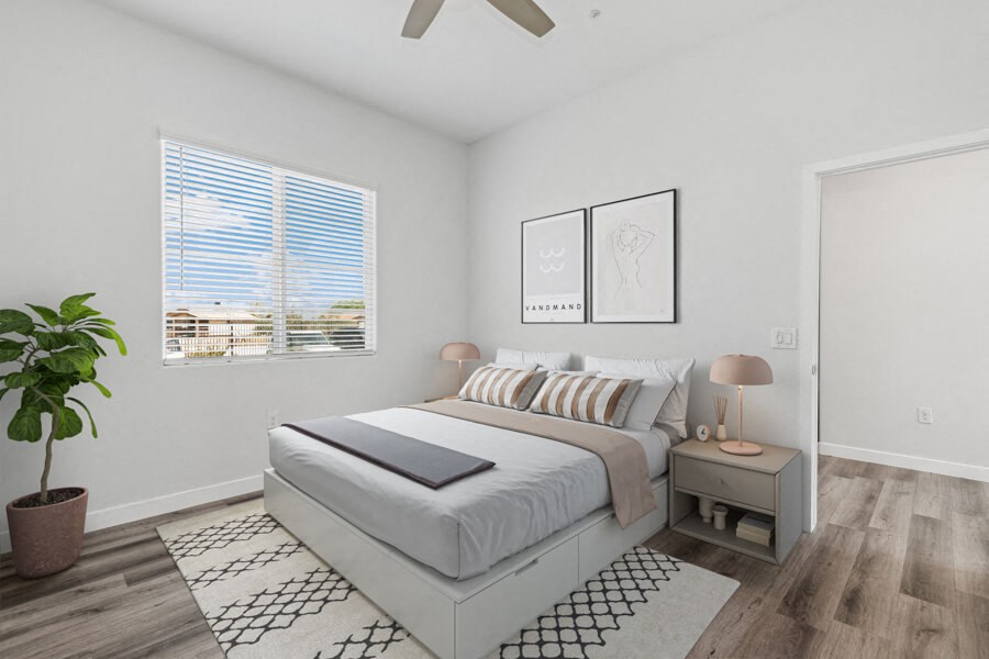 a bedroom with a bed and a window