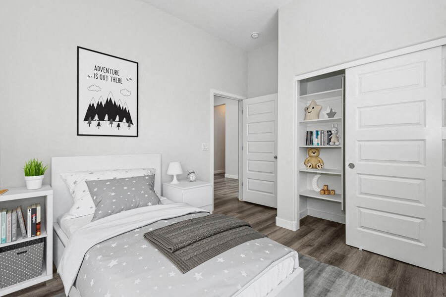 a bedroom with a bed and a closet