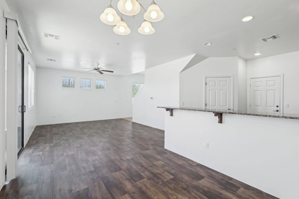 A room with wooden floors and white walls.