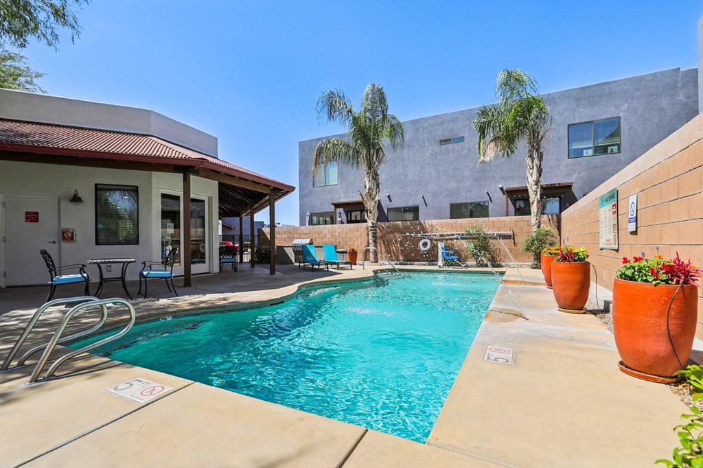 A pool with a red and white sign on the side of it.