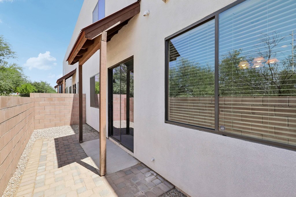 A modern house with a white exterior and a glass door.