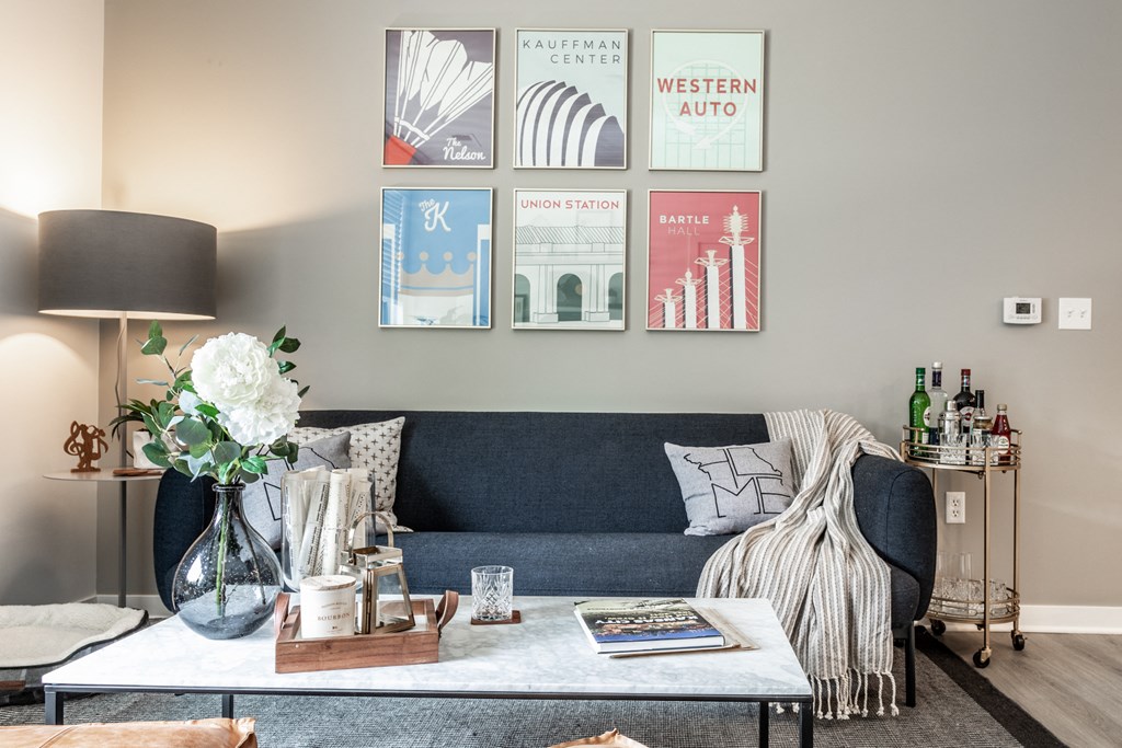 a living room with a blue couch and a coffee table