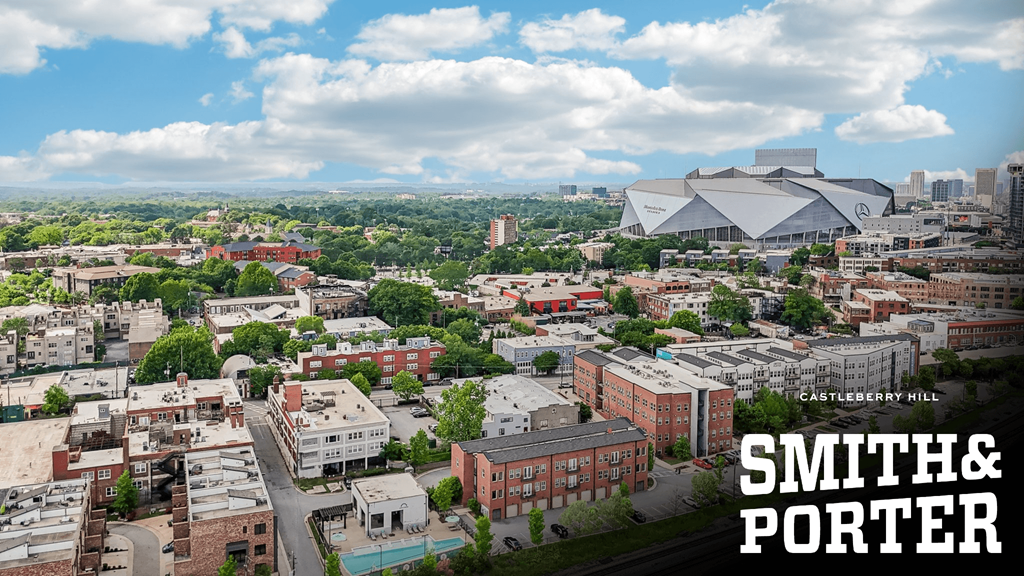 A cityscape with a stadium and the words
