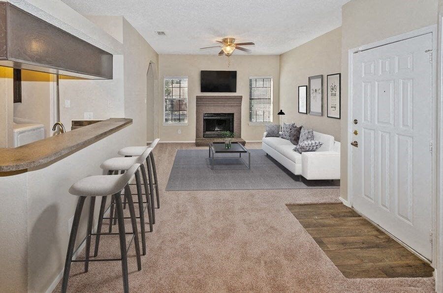 a living room with a bar and a couch at Heatherstone, Dallas, 75287