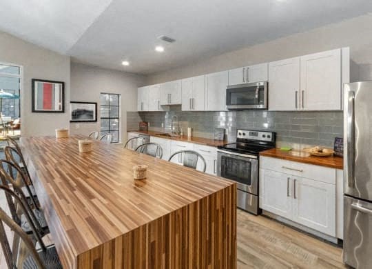 a kitchen with a wooden counter top at Heatherstone, Dallas, 75287