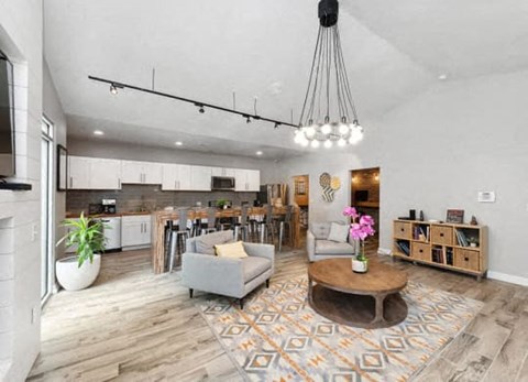 a living room with a kitchen and a dining room