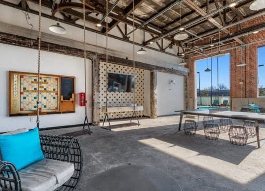 a large room with swings and a table and chairs at Smith and Porter, Georgia, 30313