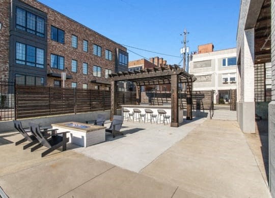 a patio with a table and chairs in front of a building at Smith and Porter, Atlanta, GA, 30313