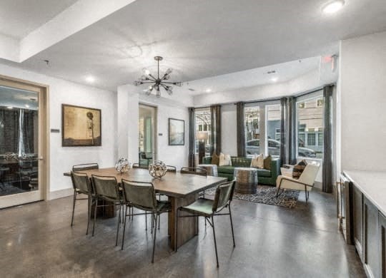 a dining room and living room with a table and chairs at Smith and Porter, Atlanta, GA