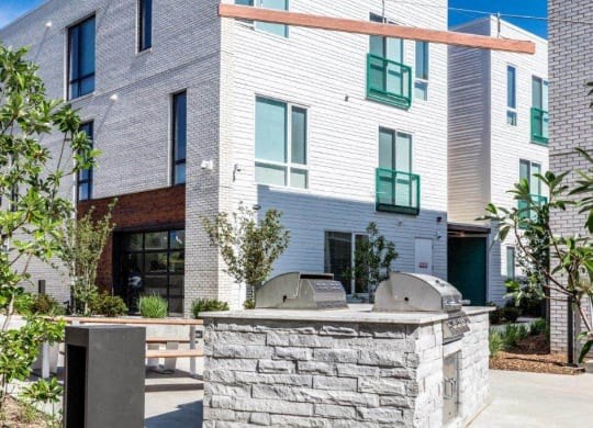 a building with a stone wall in front of it at Marcato, Kansas City, Missouri